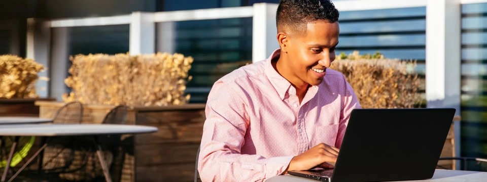 Person working on a laptop outdoors
