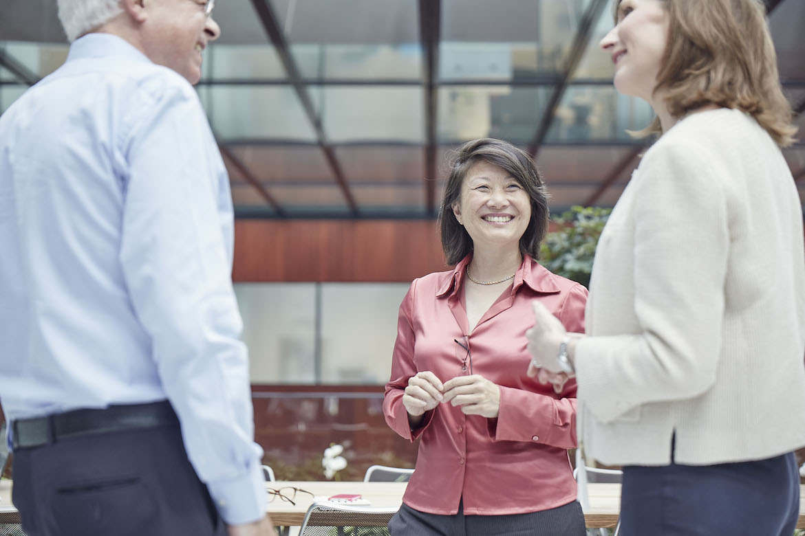 three-people-smiling-and-talking