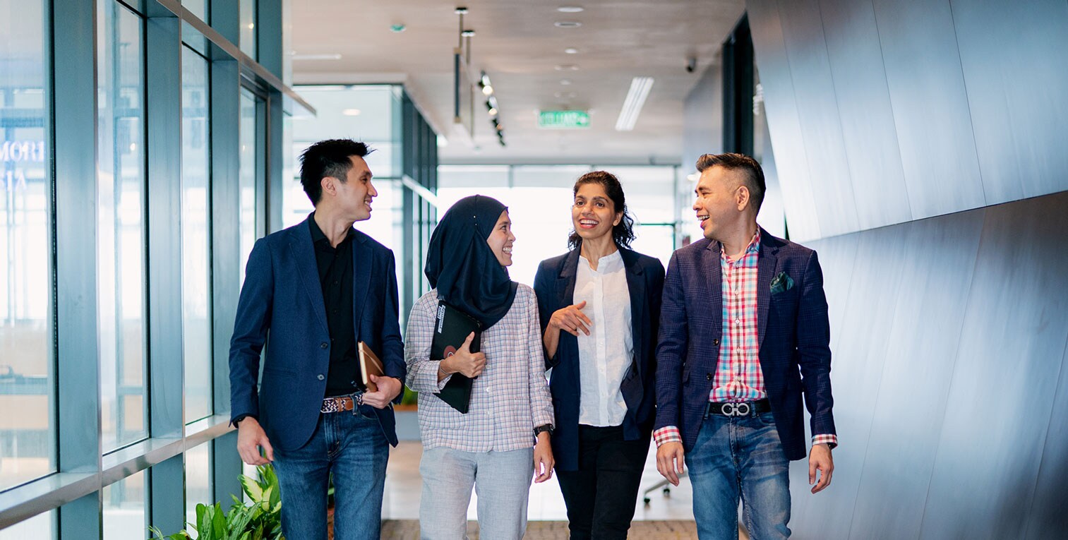 PM Malaysia employees walking through corridor