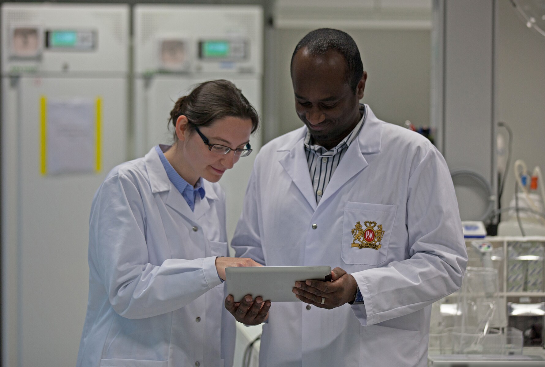 two-researchers-looking-at-tablet