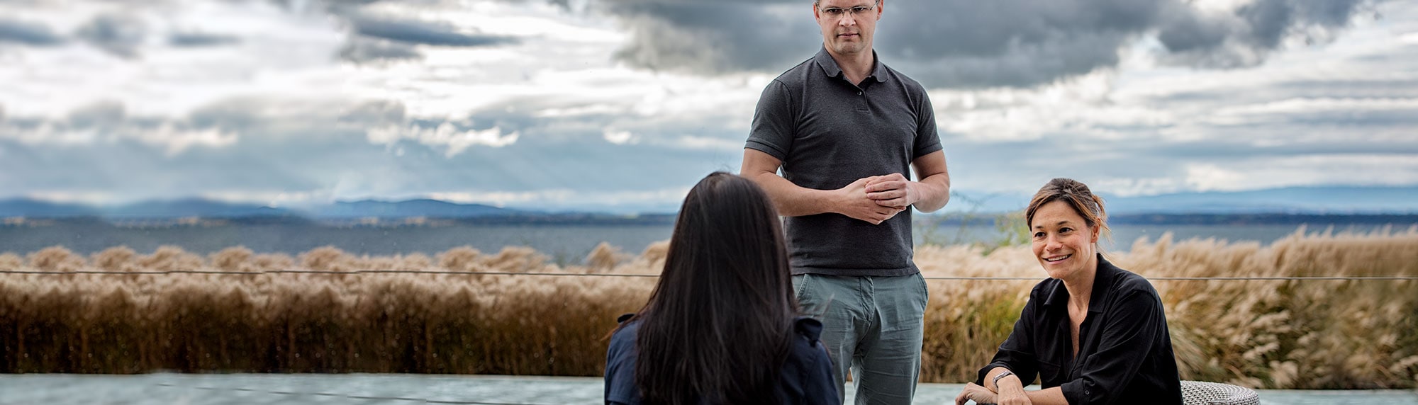 Neuchatel-employees-outside-banner