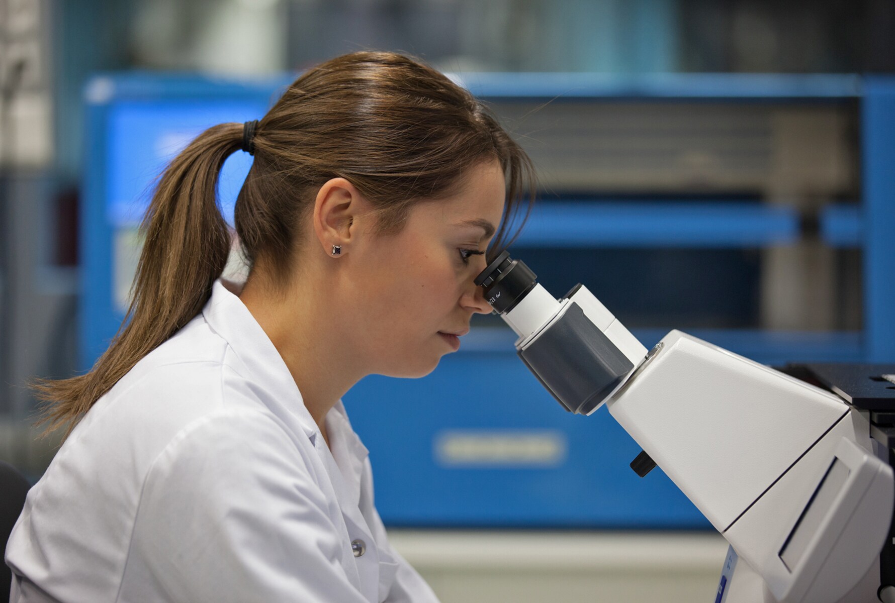 Female scientist Neuchatel microscope landscape