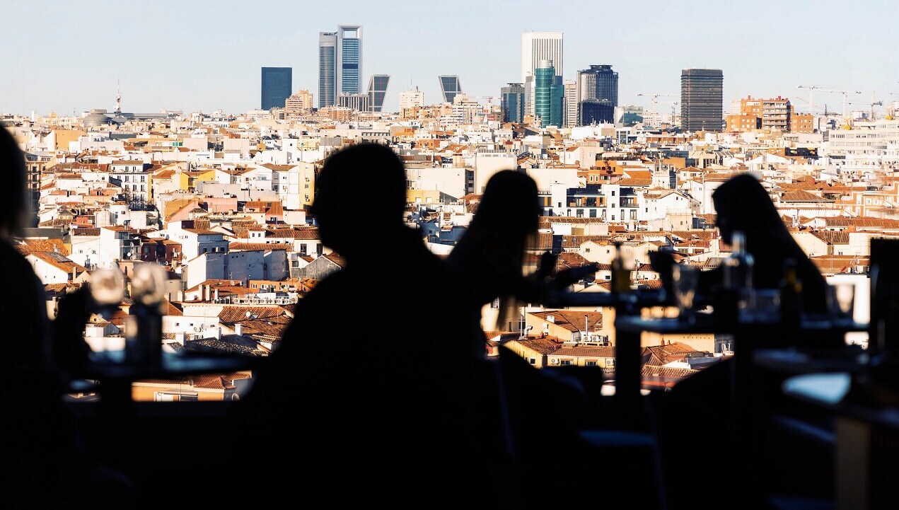 People in front of Madrid landscape