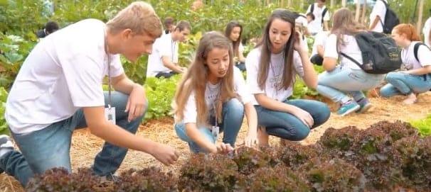 Students from the growing up right institute in the field