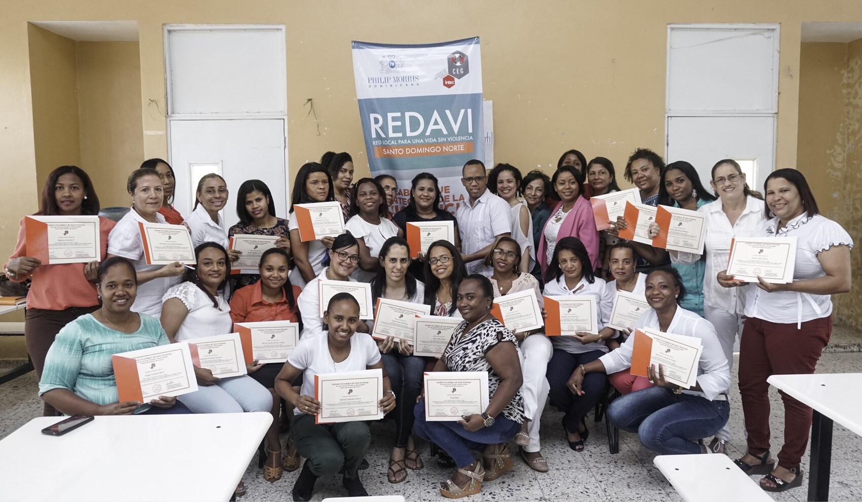 group-of-women-holding-certificates