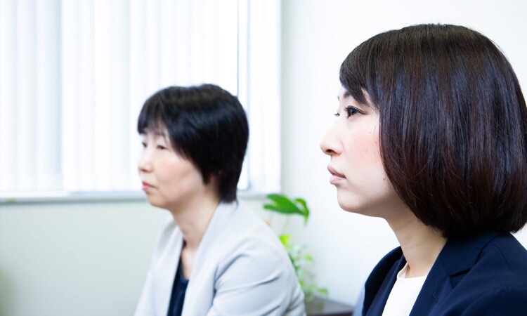 two-woman-sitting-in-an-office