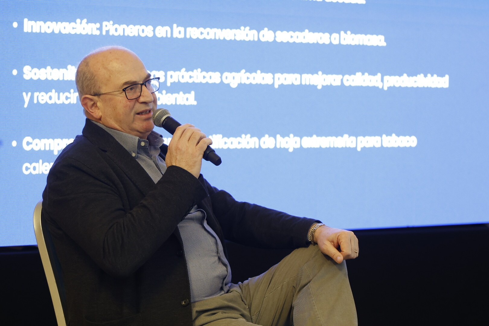 a person speaking at a lecture