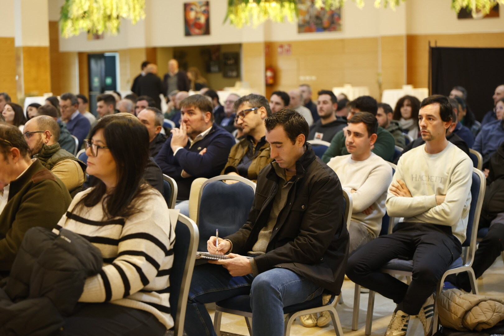 a group of people sitting at a lecture