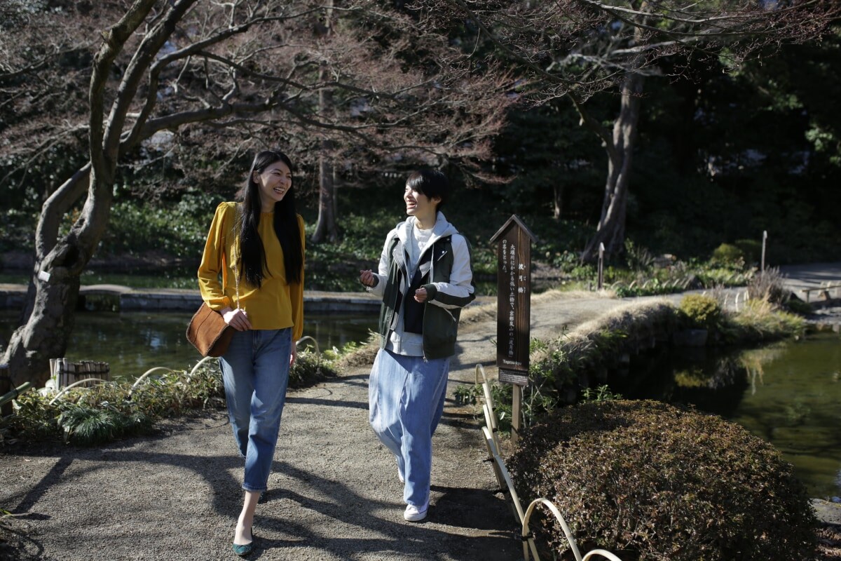women-and-man-smiling-and-walking